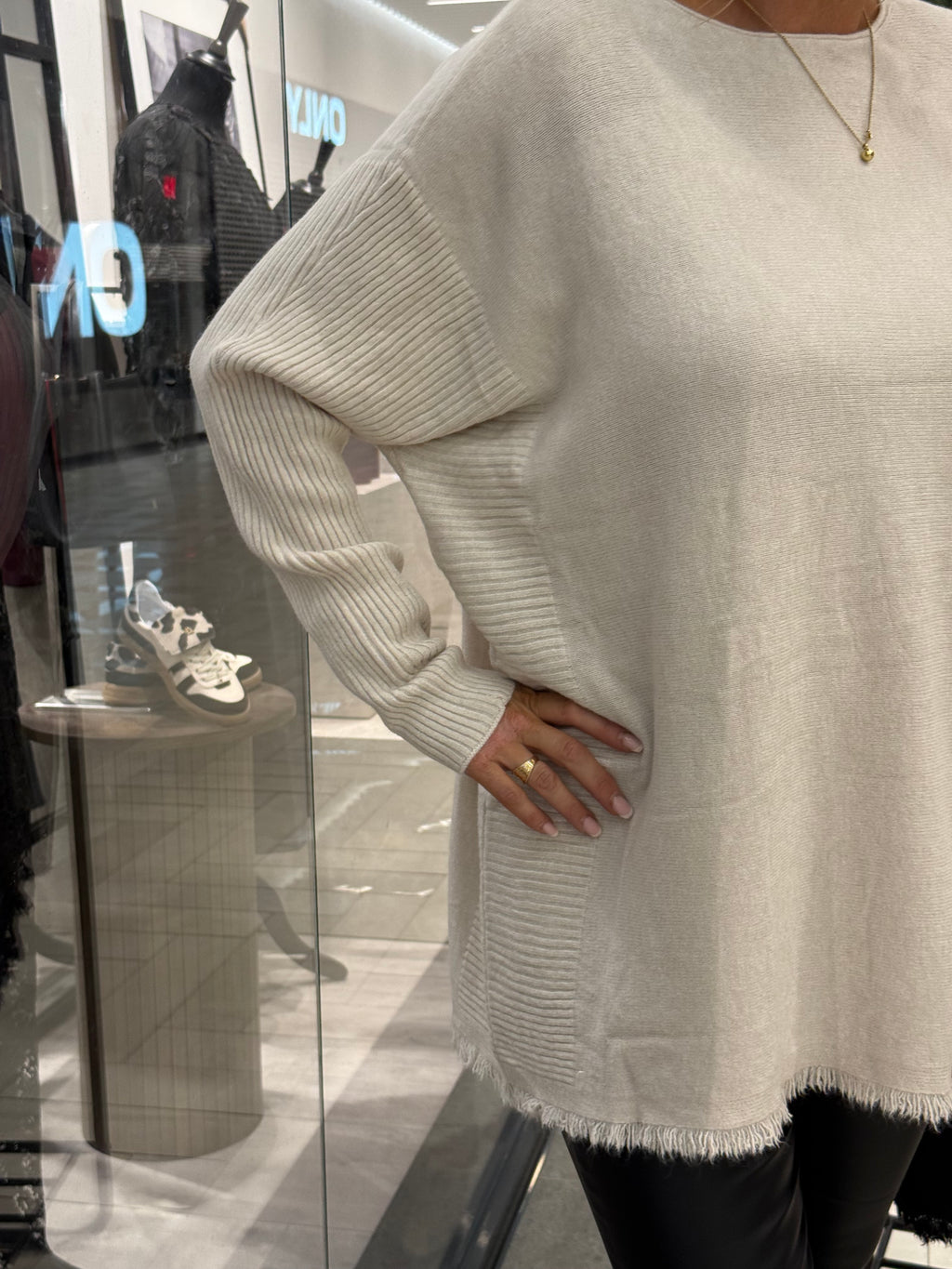 Beige sweater with long ribbed sleeves