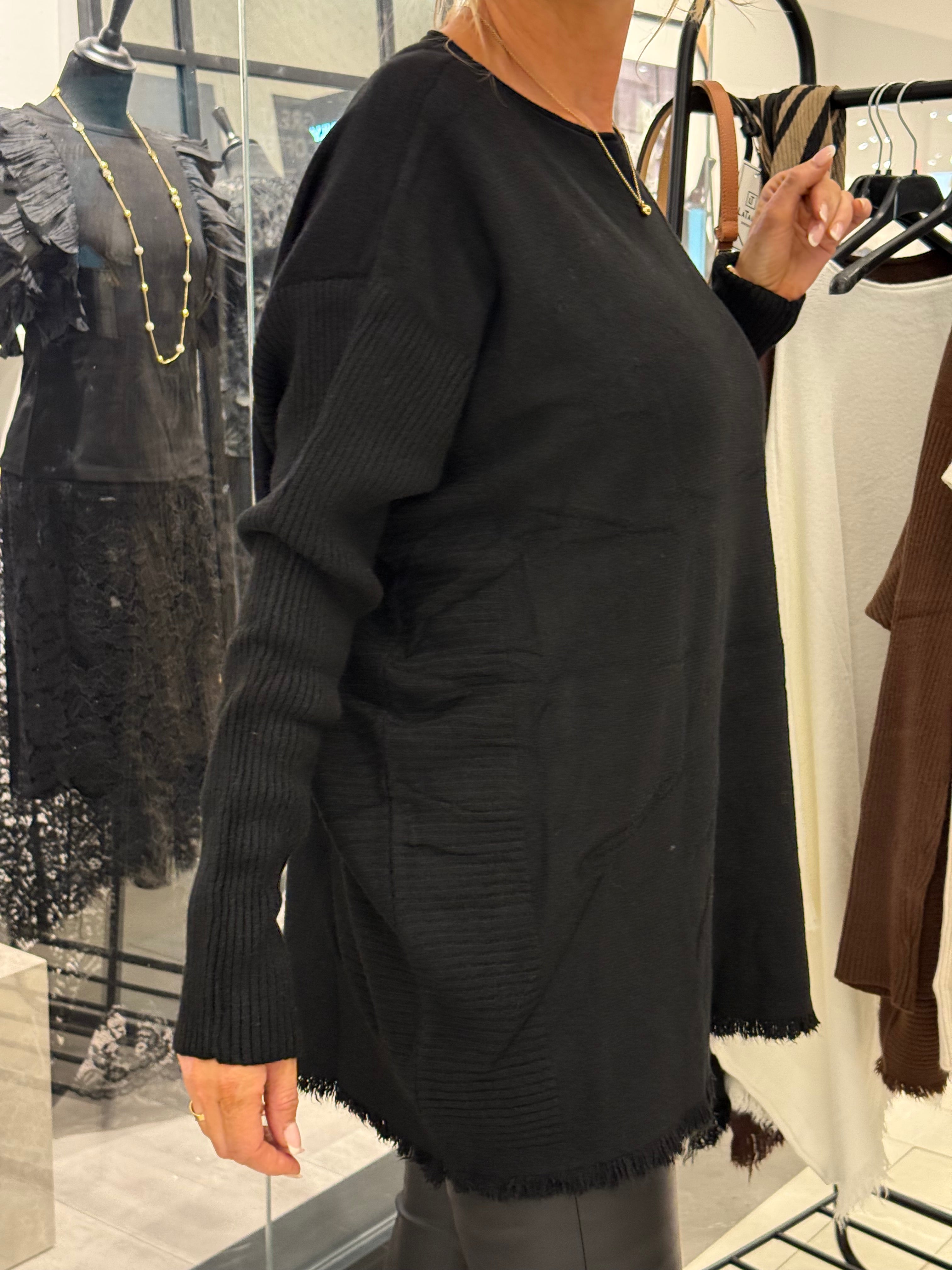 Black sweater with long ribbed sleeves