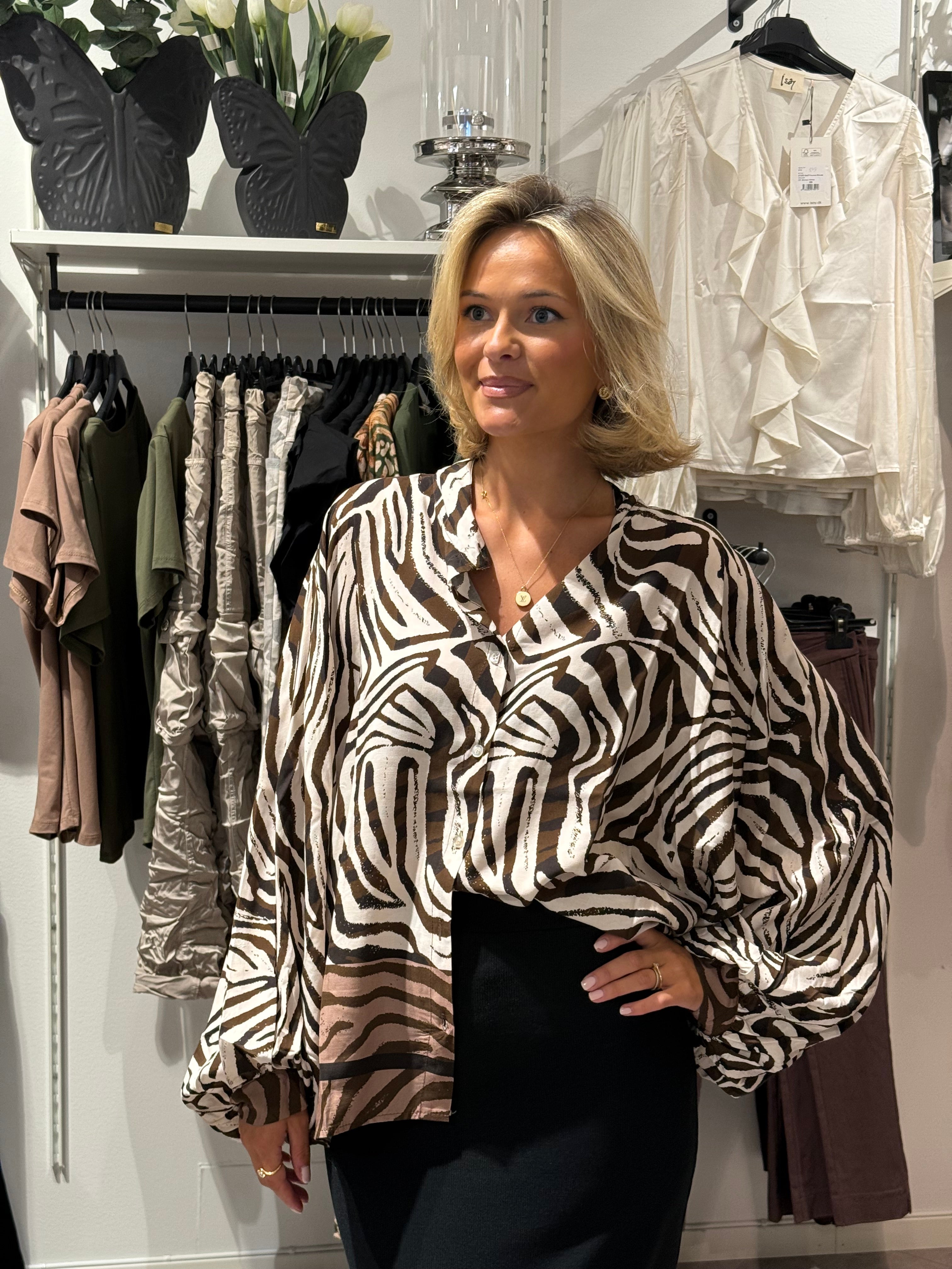 Blus med zebra mönster brun