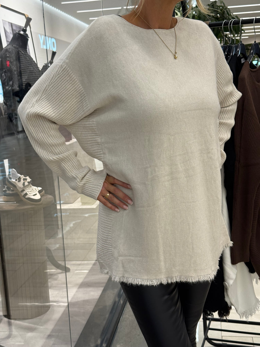 Beige sweater with long ribbed sleeves