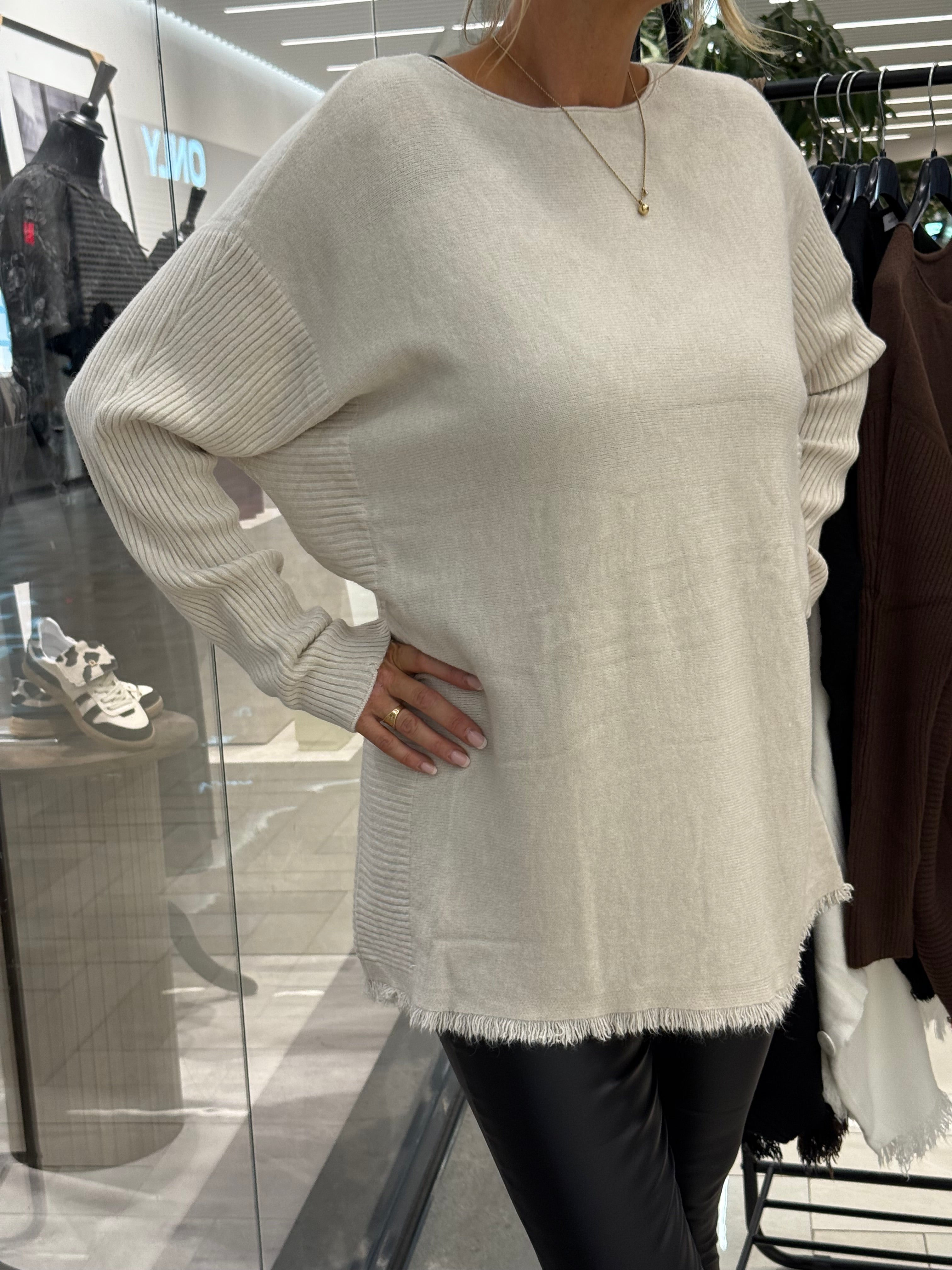 Beige sweater with long ribbed sleeves