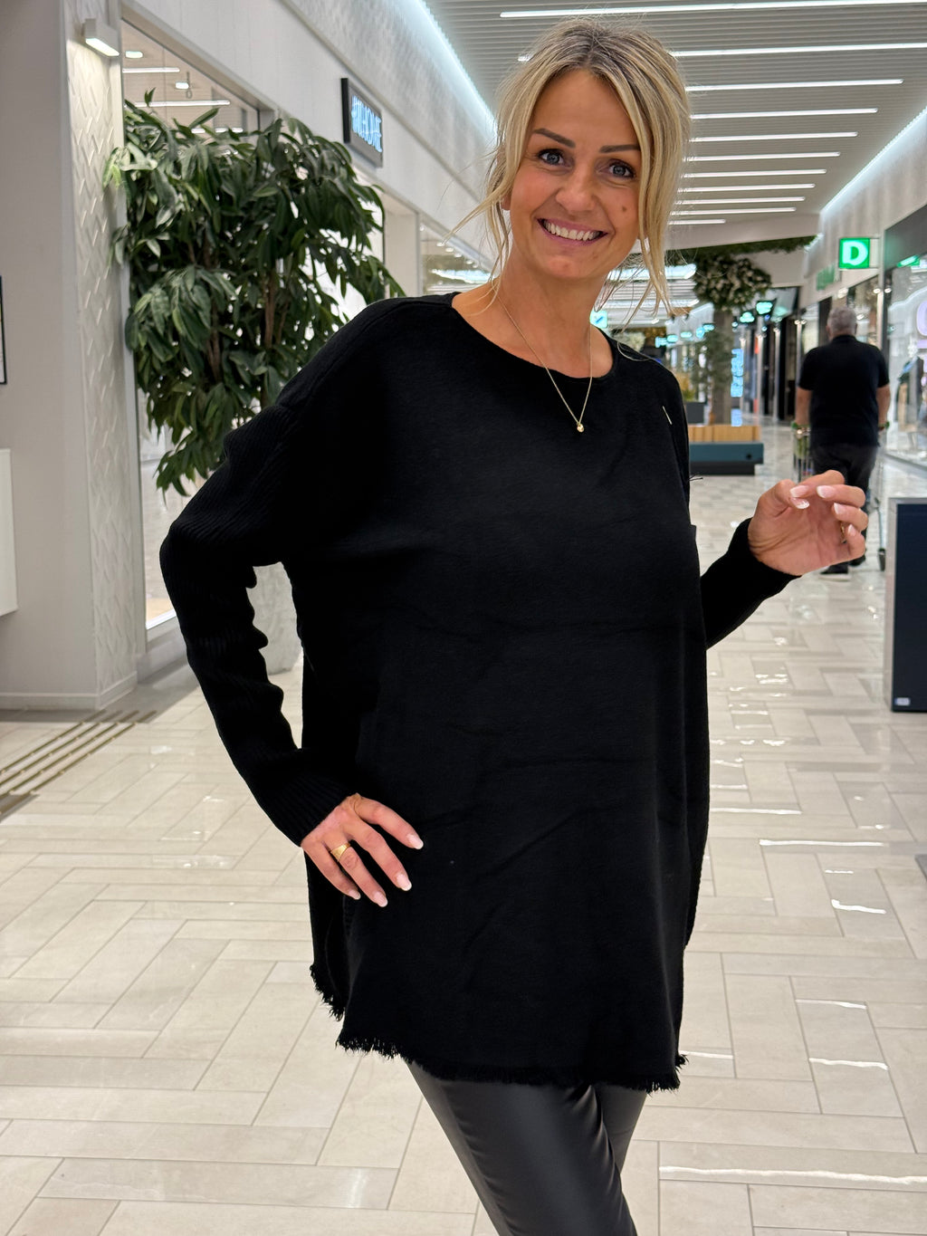 Black sweater with long ribbed sleeves